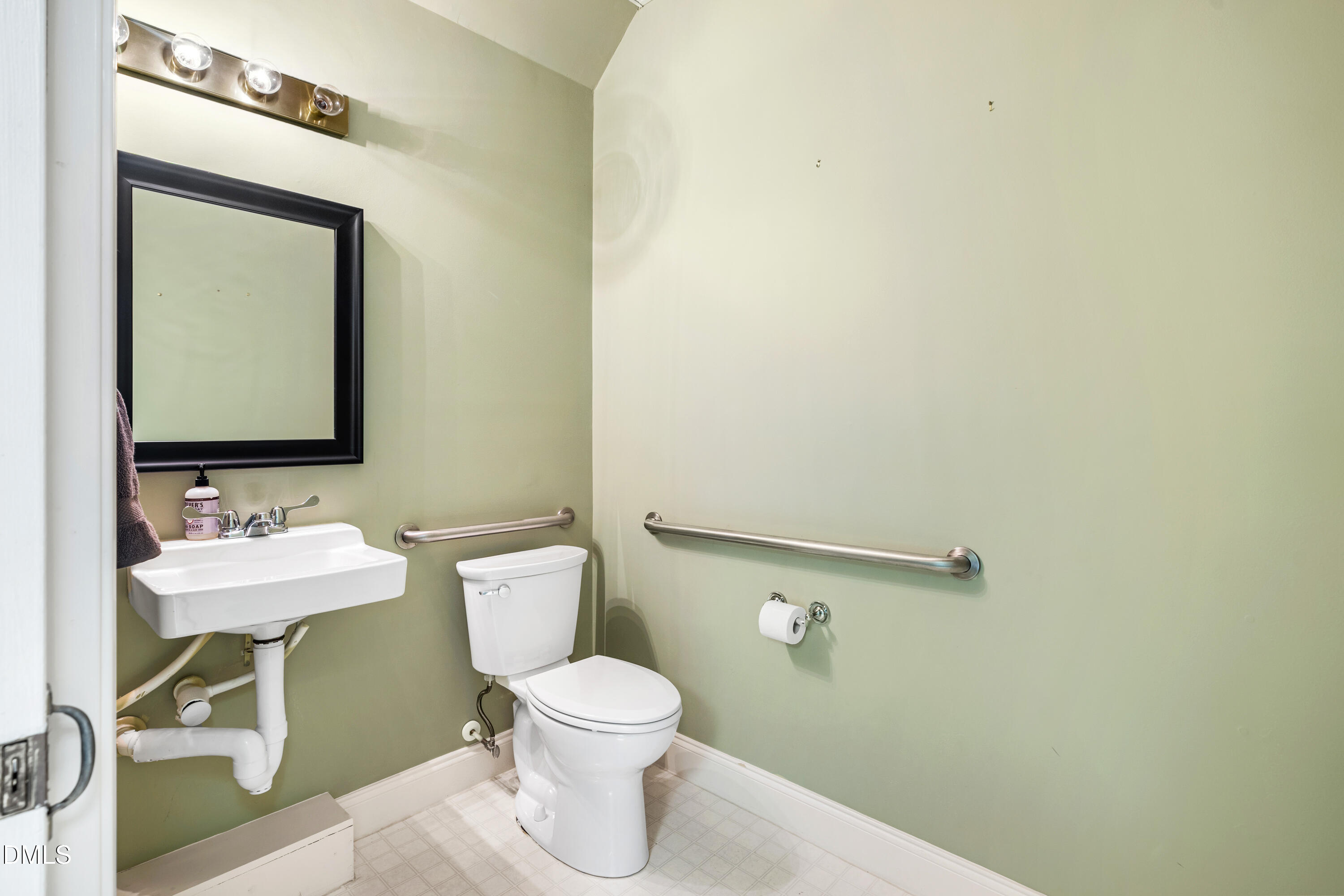 130 Salem Towne Court Apex, NC 27502 - Photo 10 of 36 a bathroom with a toilet sink and mirror