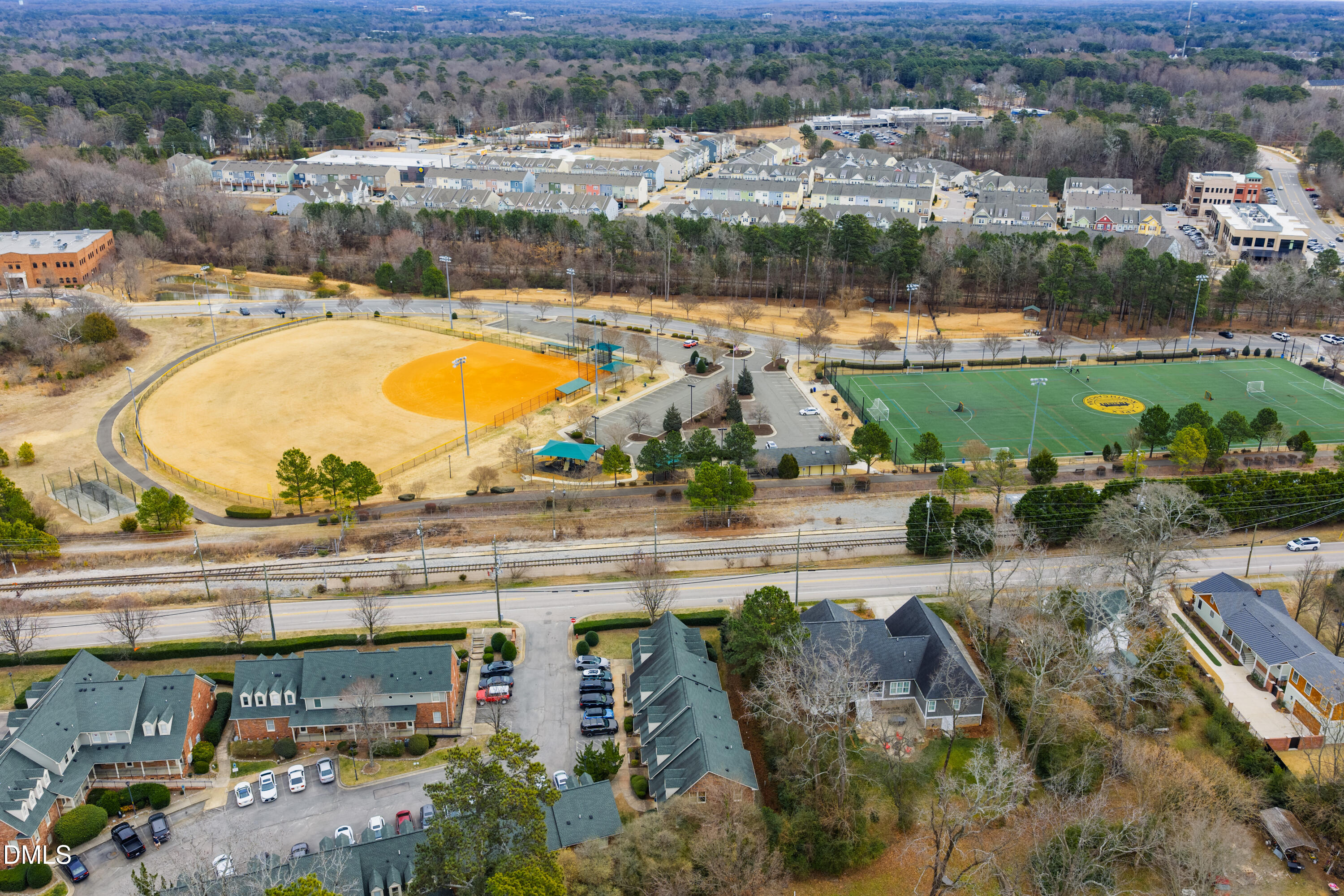 130 Salem Towne Court Apex, NC 27502 - Photo 31 of 36 an aerial view of a house with a swimming pool and outdoor space