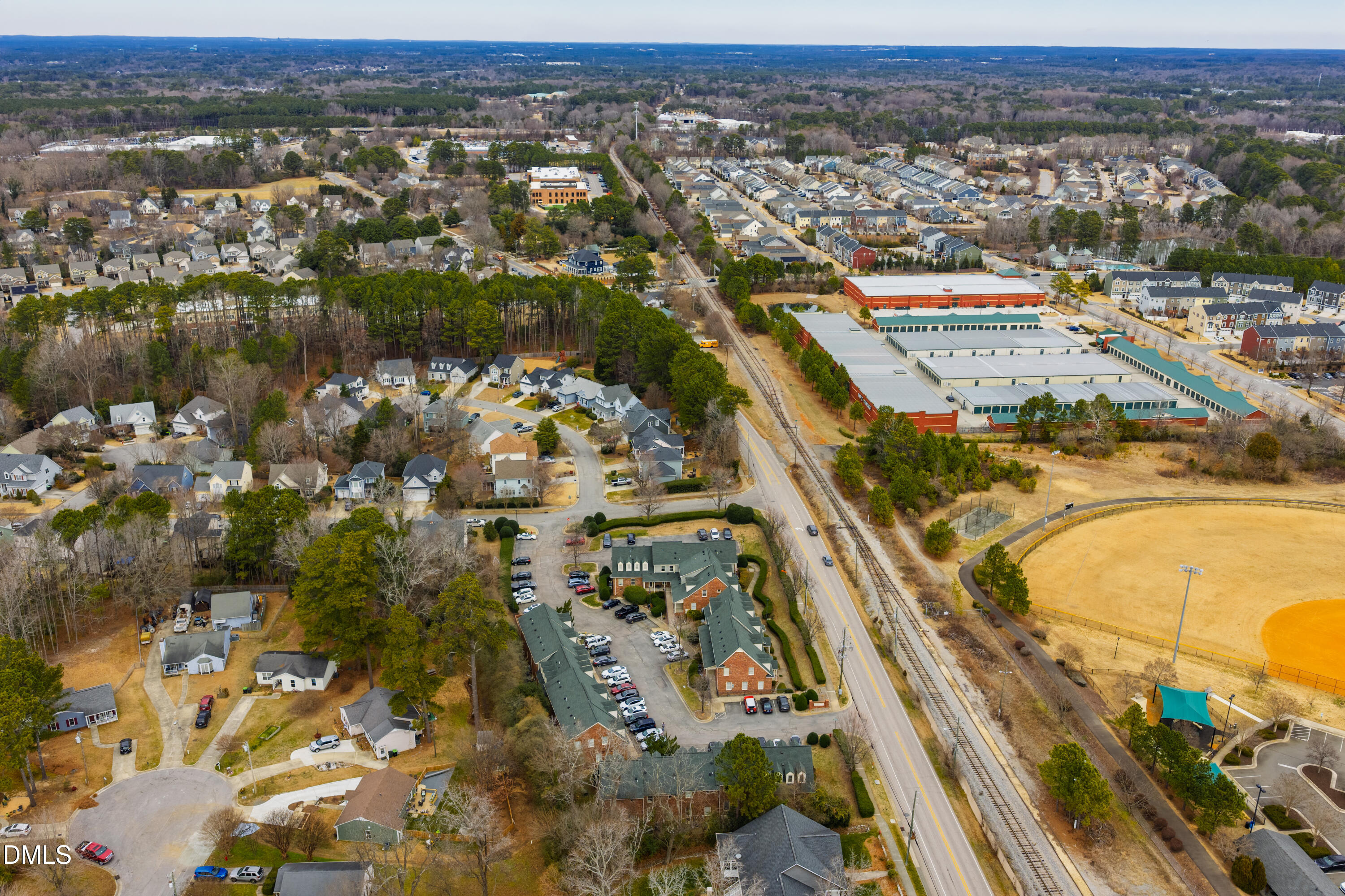 130 Salem Towne Court Apex, NC 27502 - Photo 32 of 36 an aerial view of residential building and lake