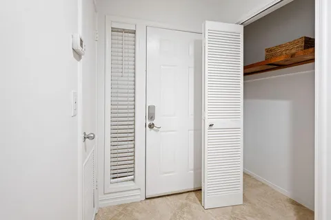 a view of a hallway with white walls