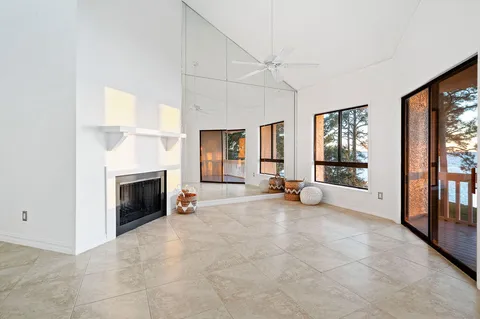 a view of a livingroom with furniture and a window