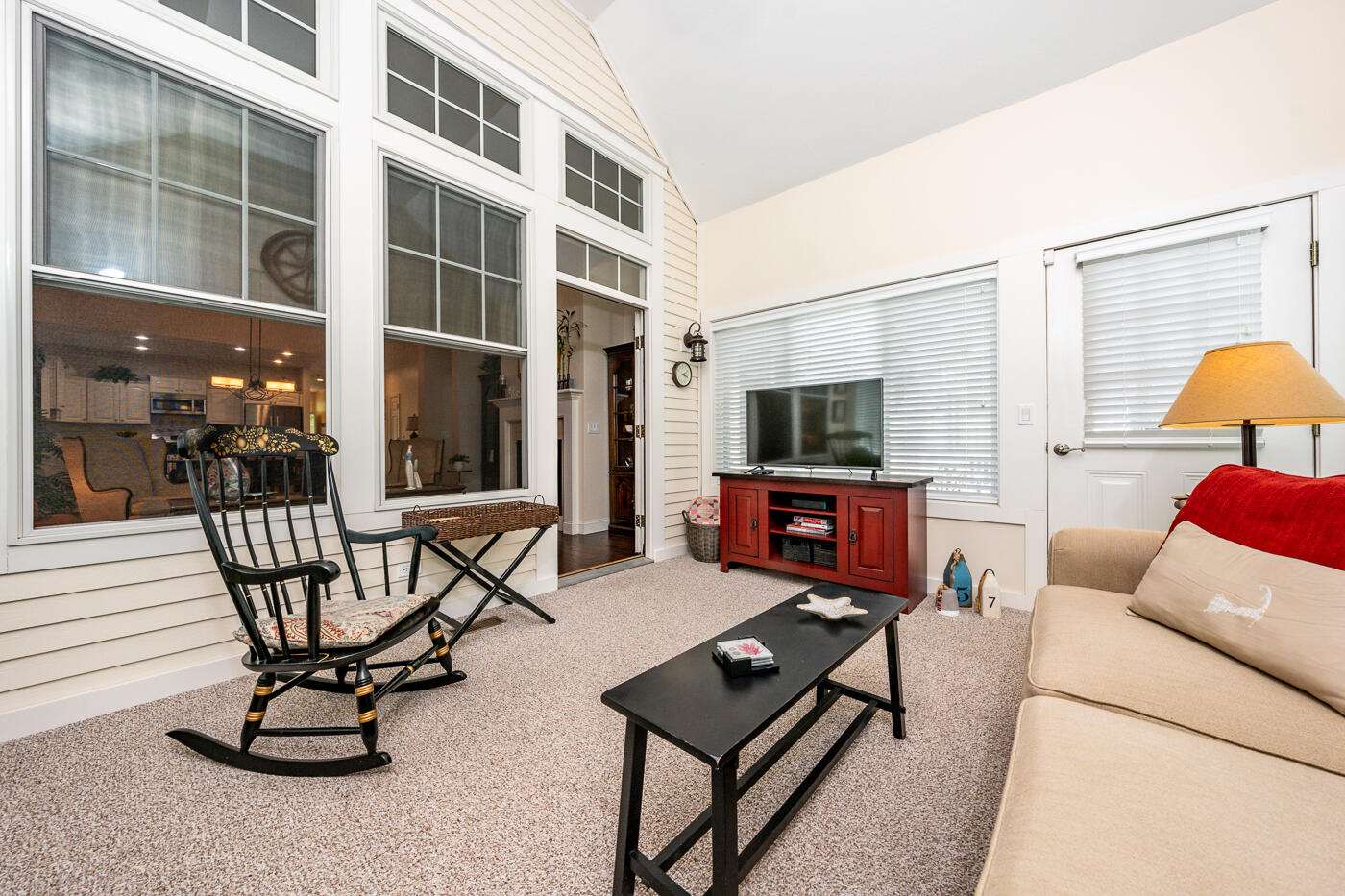 36 Southport Drive Mashpee, MA 02649 - Photo 11 of 21 a living room with furniture a flat screen tv and floor to ceiling window