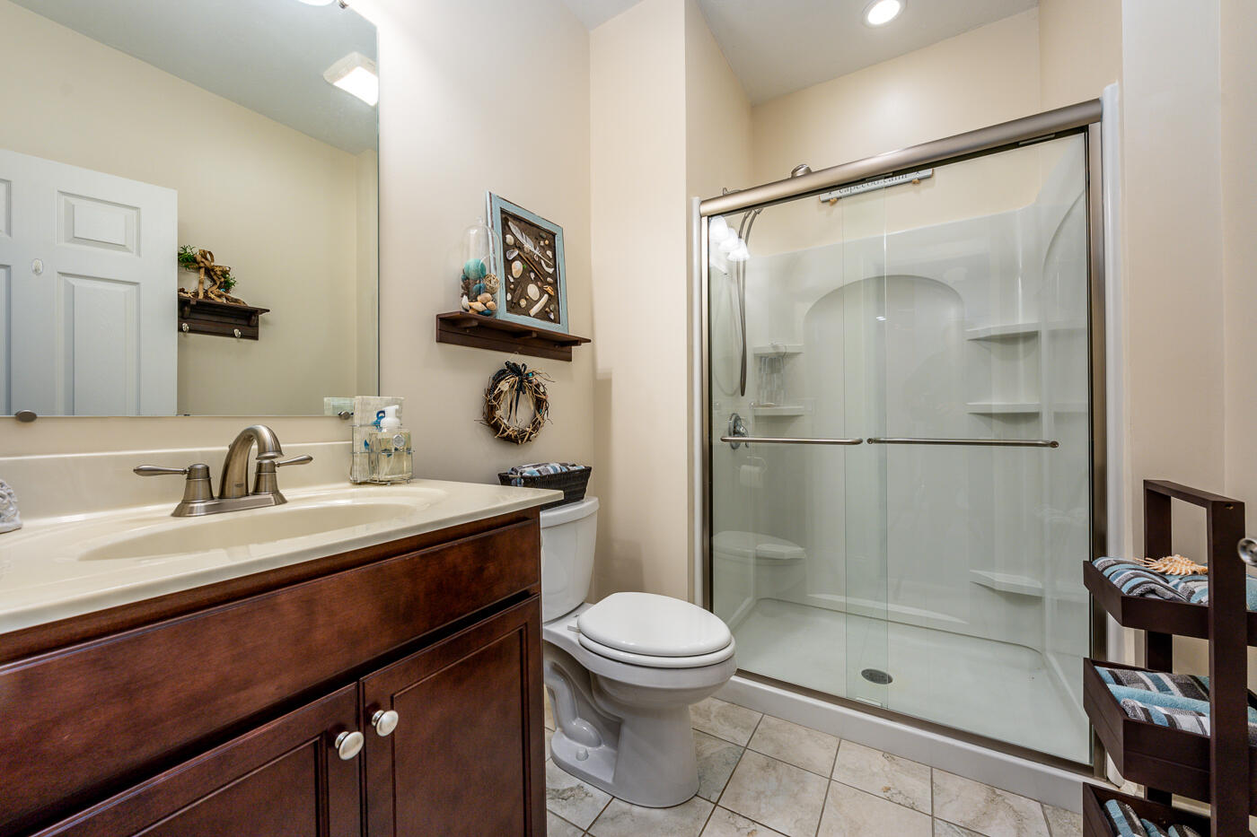 36 Southport Drive Mashpee, MA 02649 - Photo 15 of 21 a bathroom with a granite countertop sink toilet a mirror and shower