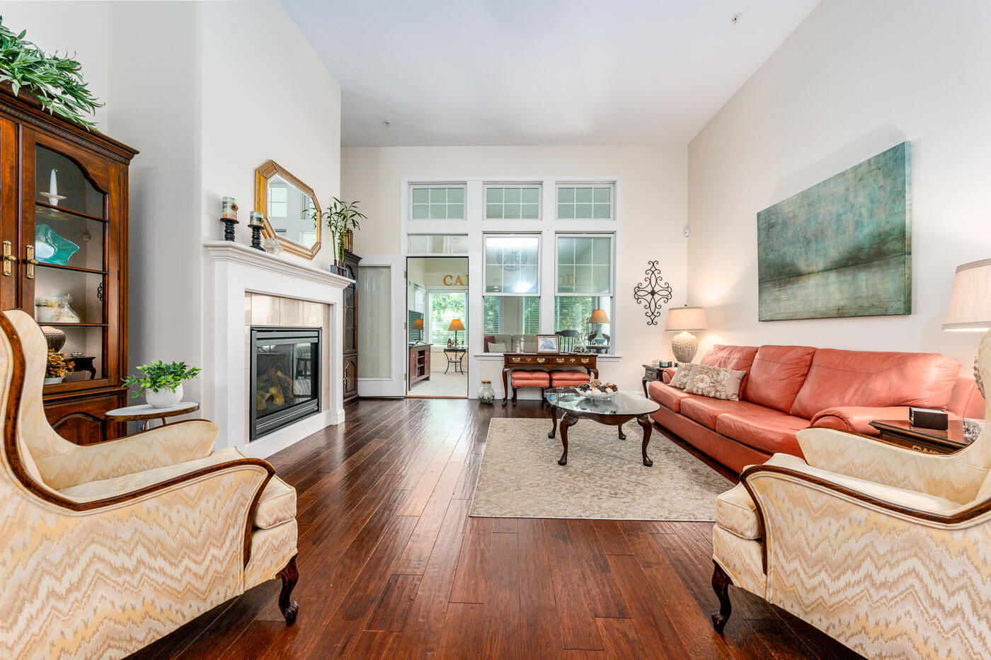 36 Southport Drive Mashpee, MA 02649 - Photo 7 of 21 a living room with furniture a fireplace and a floor to ceiling window