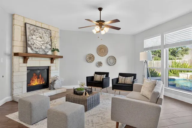 a living room with furniture and a fireplace