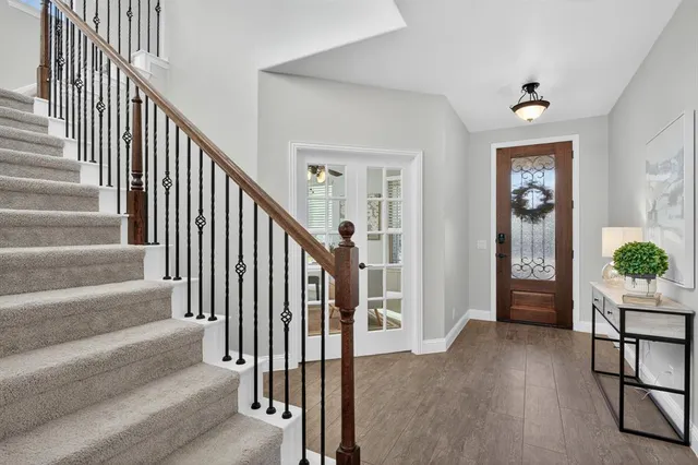 a view of a livingroom with a ceiling fan and window