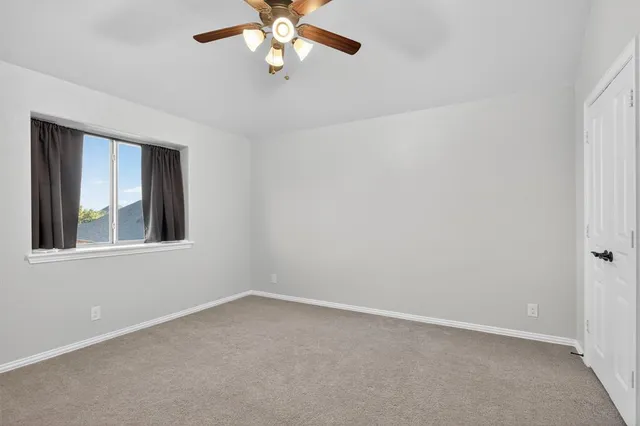 a bathroom with a double vanity sink mirror and toilet