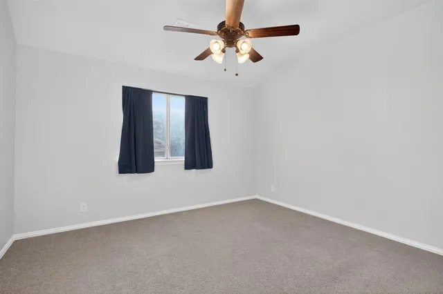 a view of a backyard with sitting area