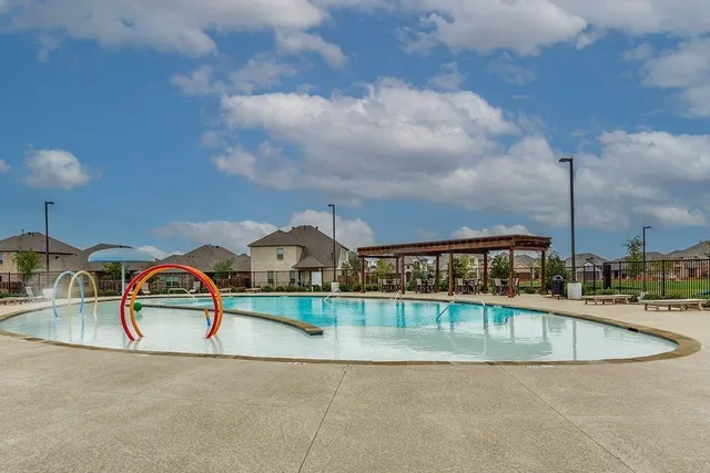 an aerial view of a swimming pool and lake view