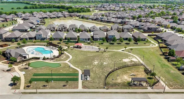 a view of a swimming pool with a yard