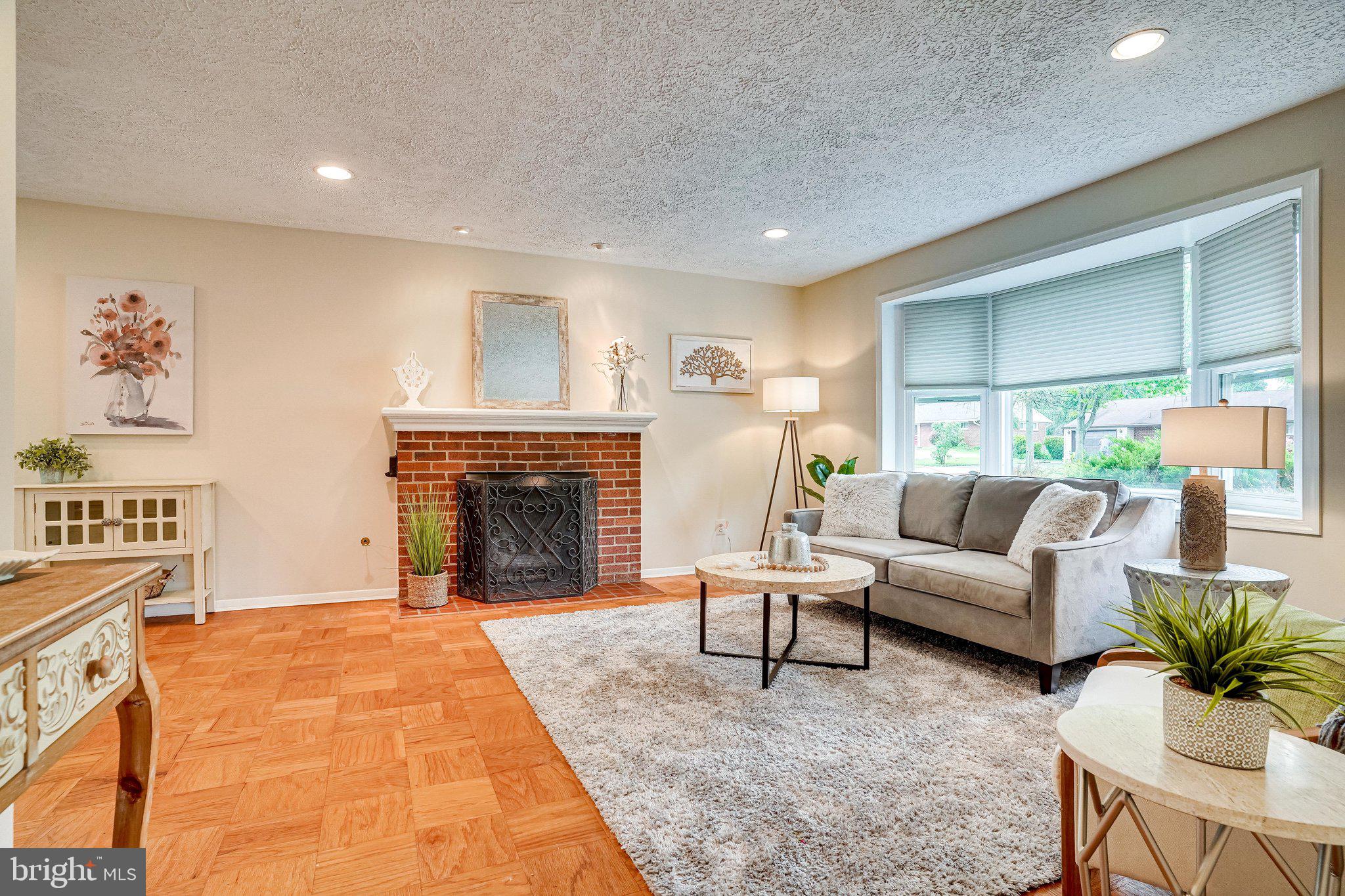 7309 Bath Street Springfield, VA 22150 - Photo 13 of 75 Living Room with Gas Fireplace and Bay Window