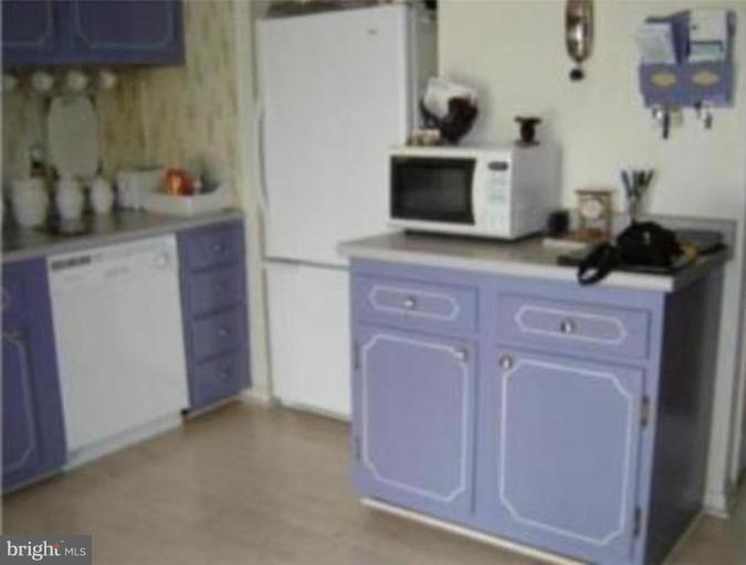 4775 Melbourne Road Baltimore, MD 21229 - Photo 6 of 8 a kitchen with a sink and cabinets