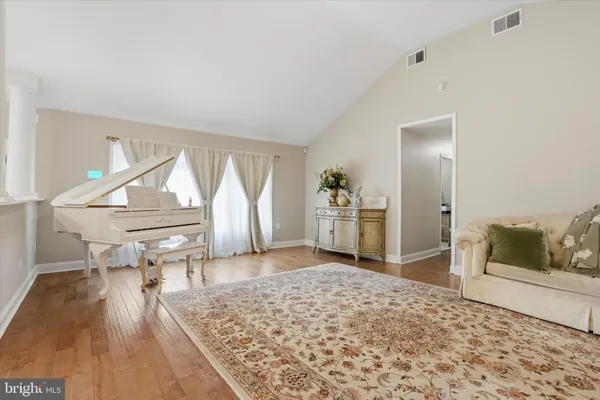 a living room with furniture fireplace and flat screen tv