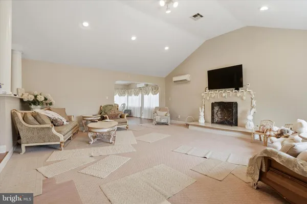 a dining room with furniture and wooden floor