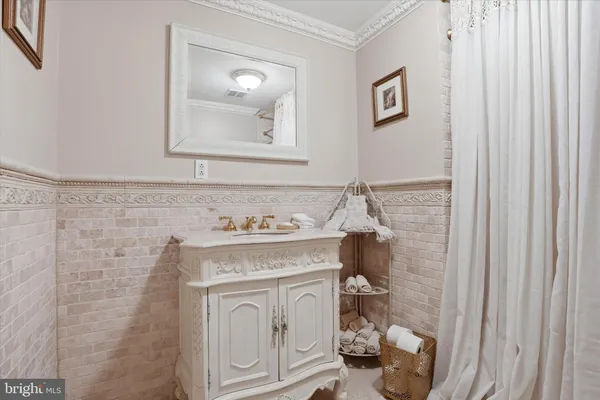 a bath tub sitting next to a white toilet and sink