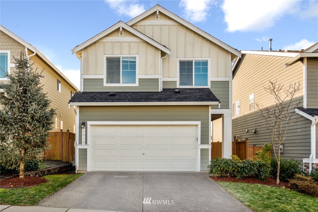 3910 177th Street Southeast Bothell, WA 98012 - Photo 1 of 27 a front view of house with yard and trees