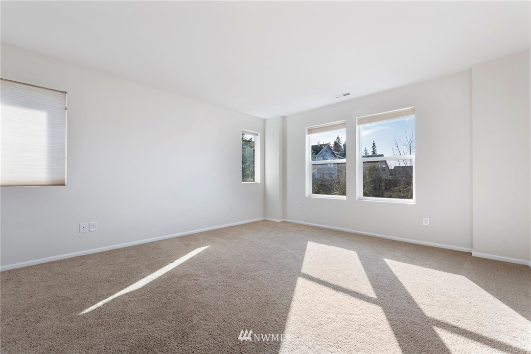 3910 177th Street Southeast Bothell, WA 98012 - Photo 11 of 27 an empty room with windows