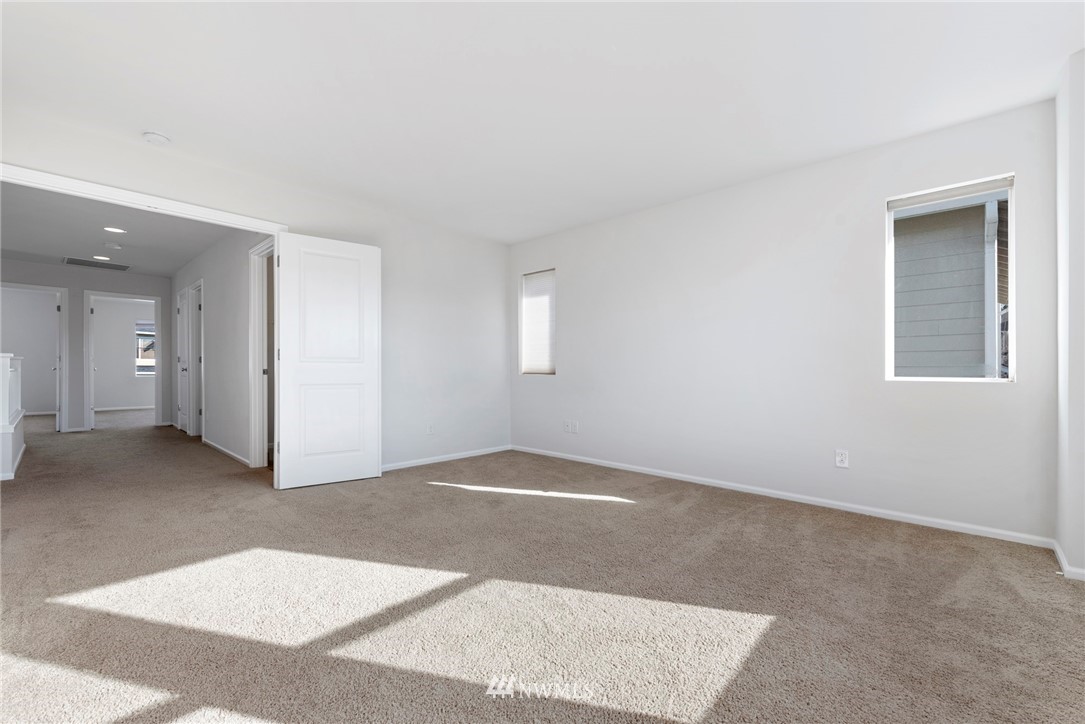 3910 177th Street Southeast Bothell, WA 98012 - Photo 12 of 27 an empty room with windows and closet