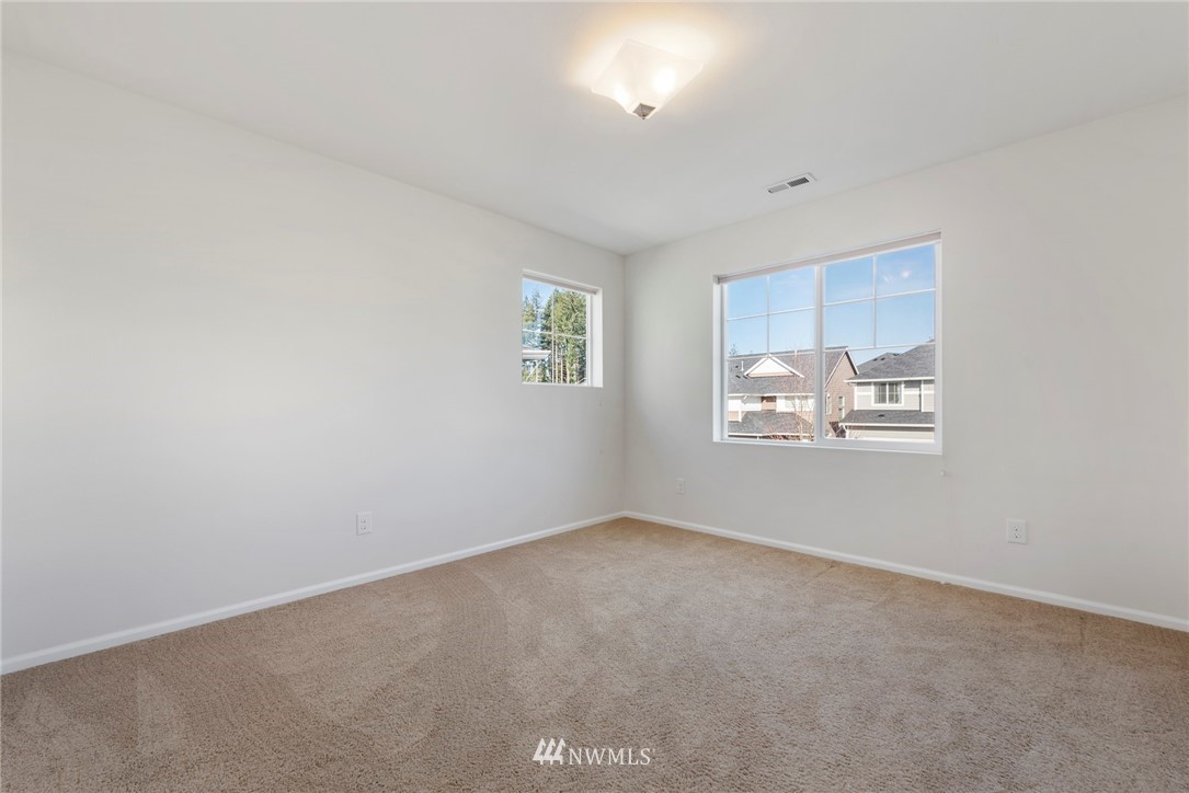3910 177th Street Southeast Bothell, WA 98012 - Photo 19 of 27 an empty room with windows