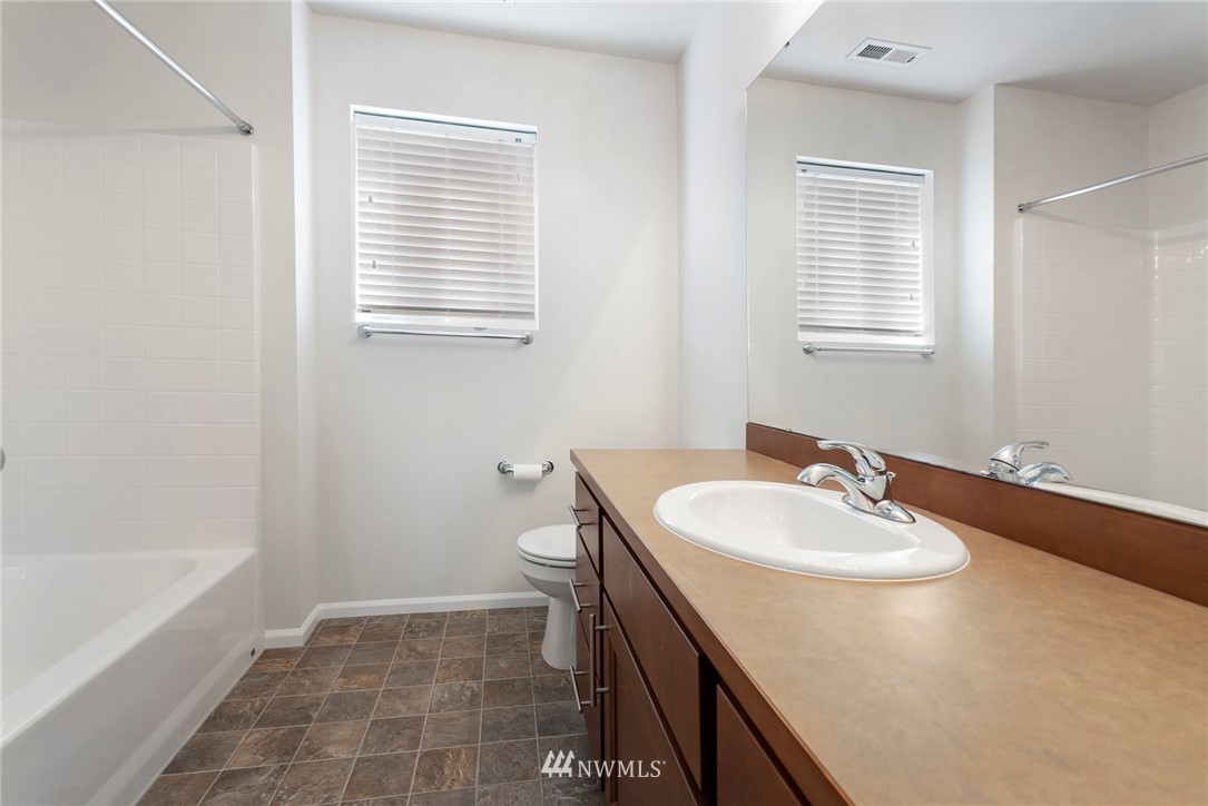 3910 177th Street Southeast Bothell, WA 98012 - Photo 21 of 27 a bathroom with a sink a toilet and tub
