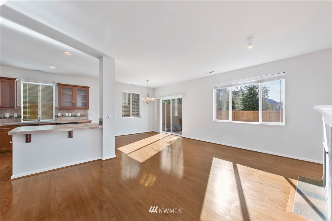 3910 177th Street Southeast Bothell, WA 98012 - Photo 5 of 27 a view of an empty room with window and wooden floor