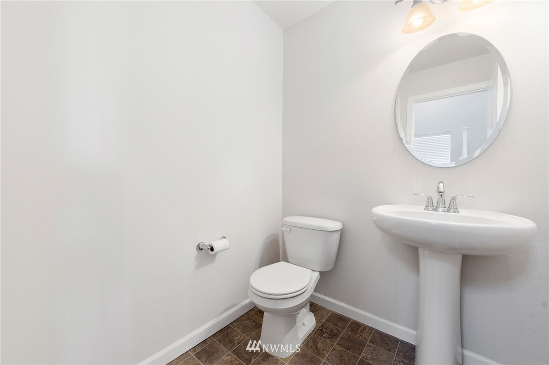 3910 177th Street Southeast Bothell, WA 98012 - Photo 9 of 27 a bathroom with a toilet a sink and mirror