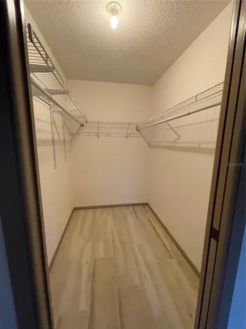 a view of a room with racks on the wall