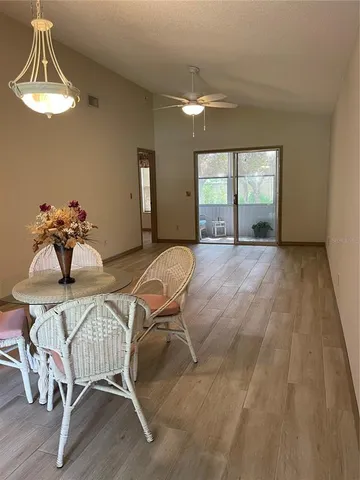 a dining room with furniture and window