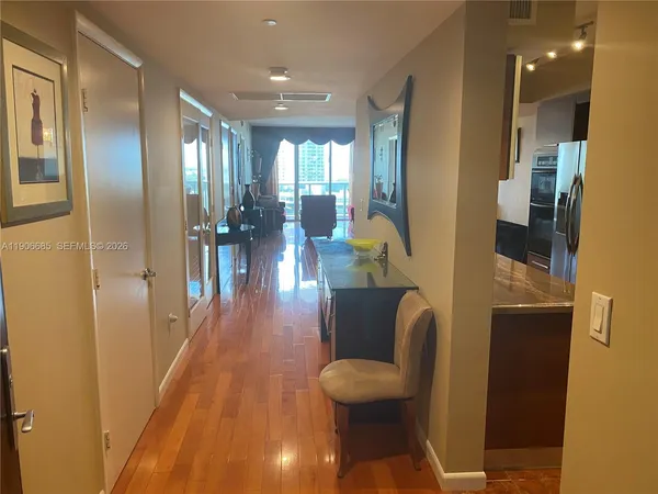 a view of a dining room with furniture and wooden floor