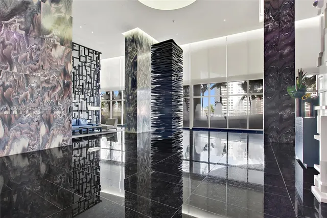 a view of a swimming pool with outdoor seating and plants