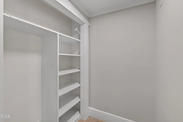 a view of an empty walk in closet