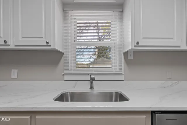 a kitchen sink with a window