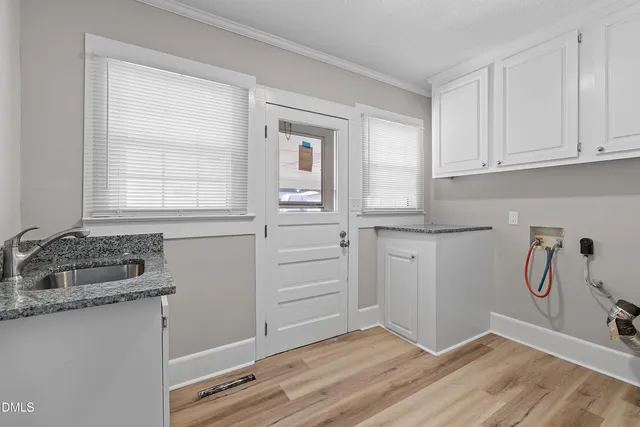 a bathroom with a sink and a window