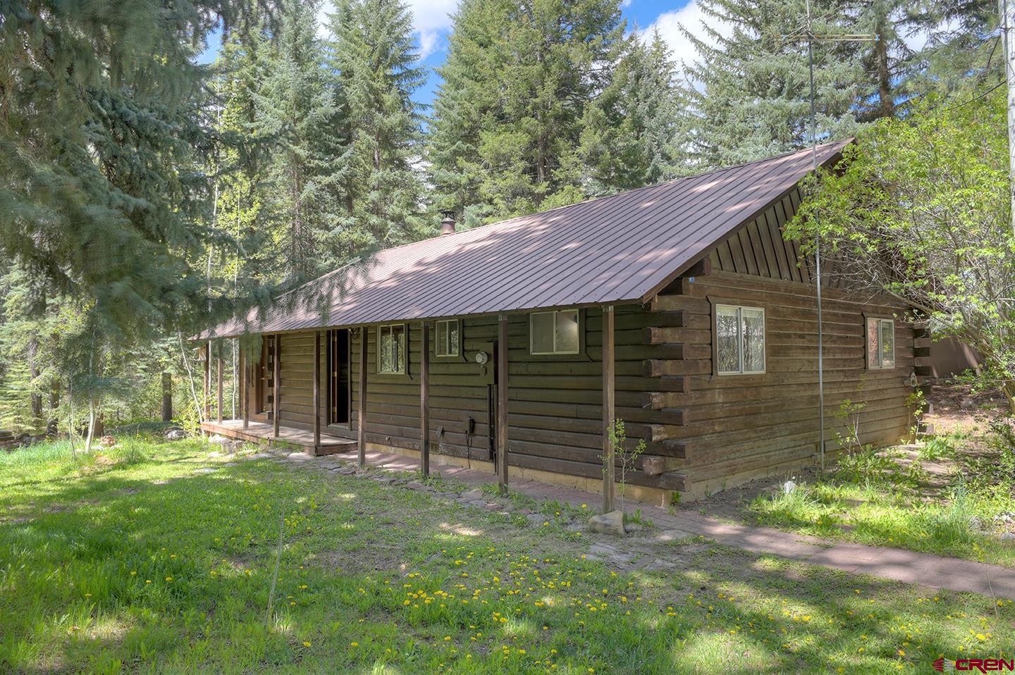 207 Verde Lane Durango, CO 81301 - Photo 1 of 45 a backyard of a house with barbeque oven