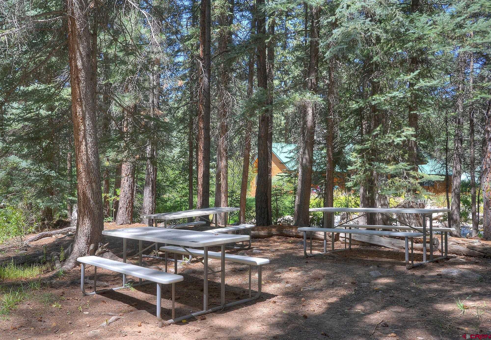 207 Verde Lane Durango, CO 81301 - Photo 12 of 45 a view of patio with a table and chairs and couches