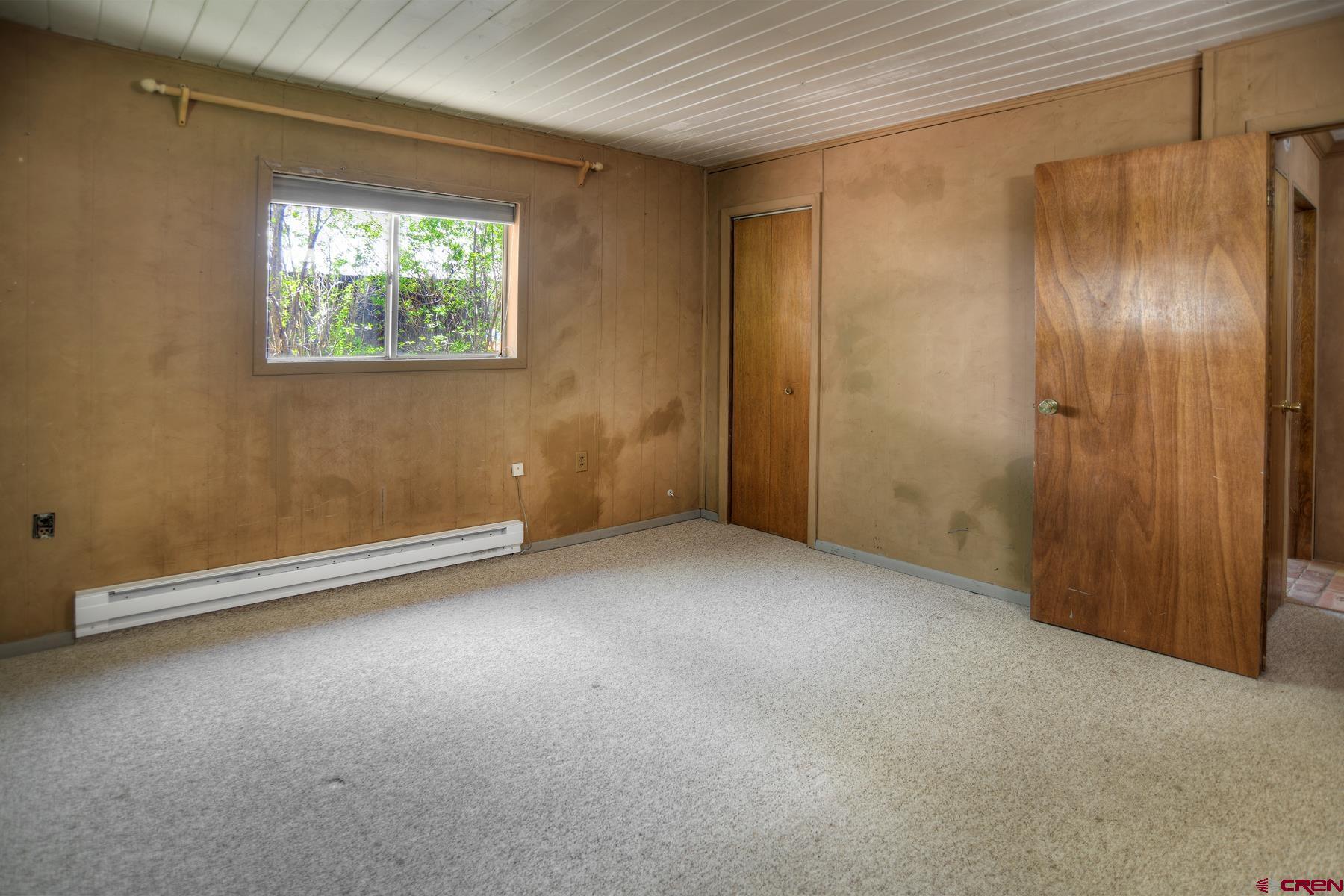 207 Verde Lane Durango, CO 81301 - Photo 25 of 45 an empty room with windows