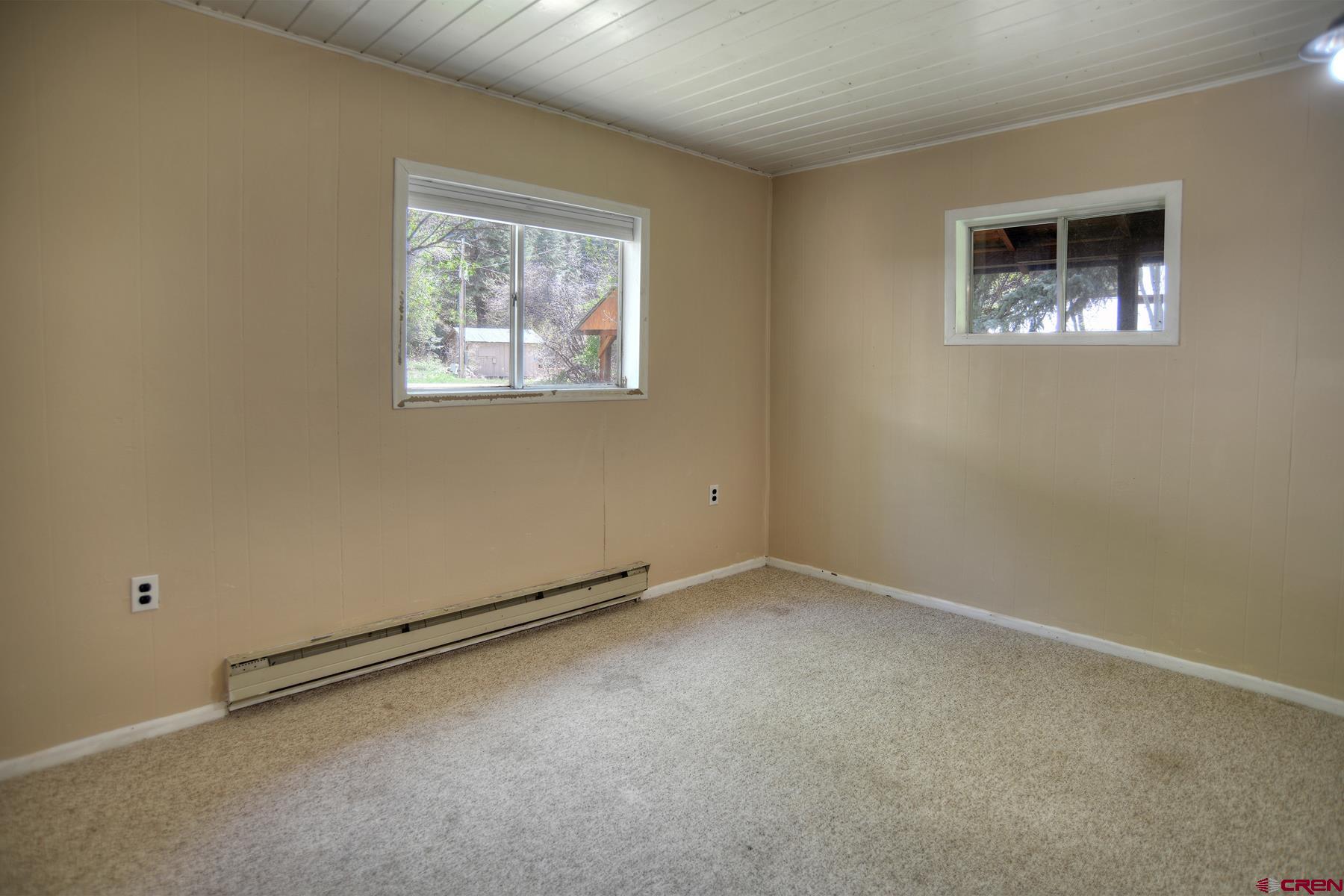 207 Verde Lane Durango, CO 81301 - Photo 29 of 45 an empty room with windows