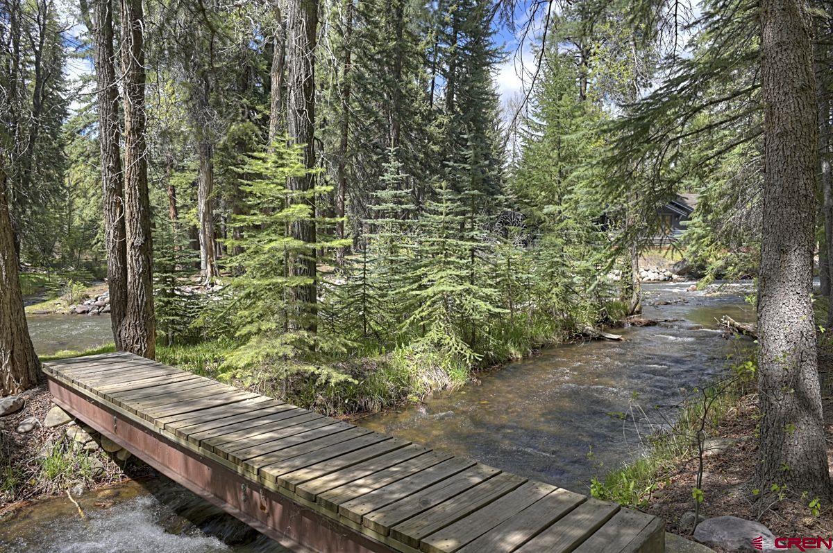207 Verde Lane Durango, CO 81301 - Photo 3 of 45 a view of a wooden floor with a bench