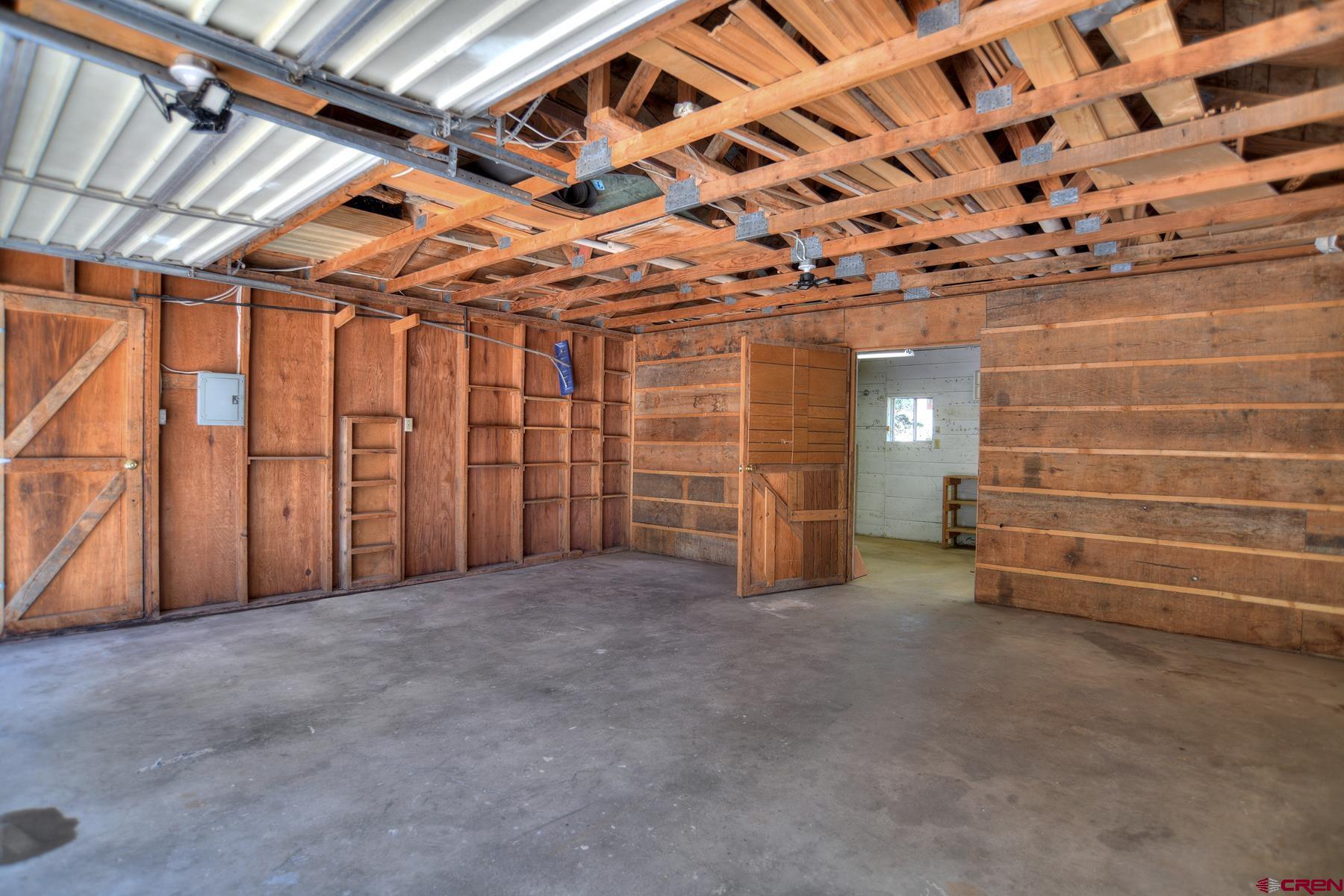 207 Verde Lane Durango, CO 81301 - Photo 32 of 45 a view of empty room with wooden walls