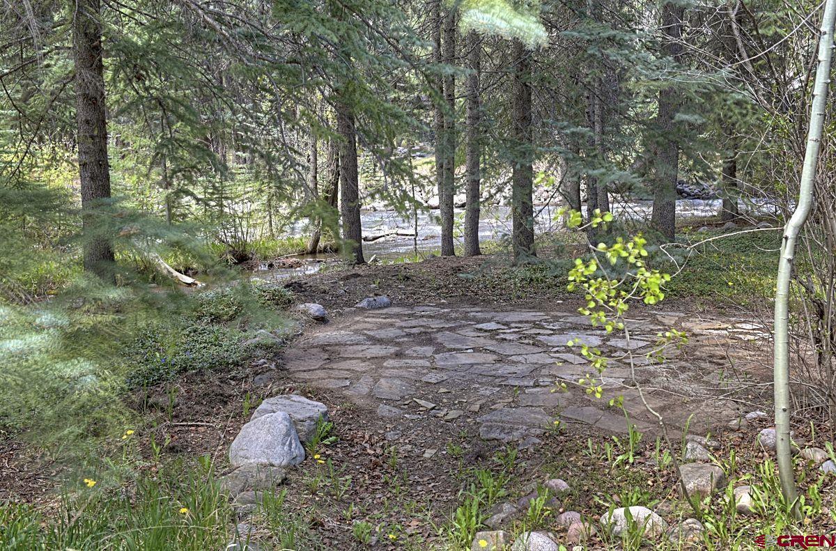 207 Verde Lane Durango, CO 81301 - Photo 8 of 45 a backyard of a house with lots of green space