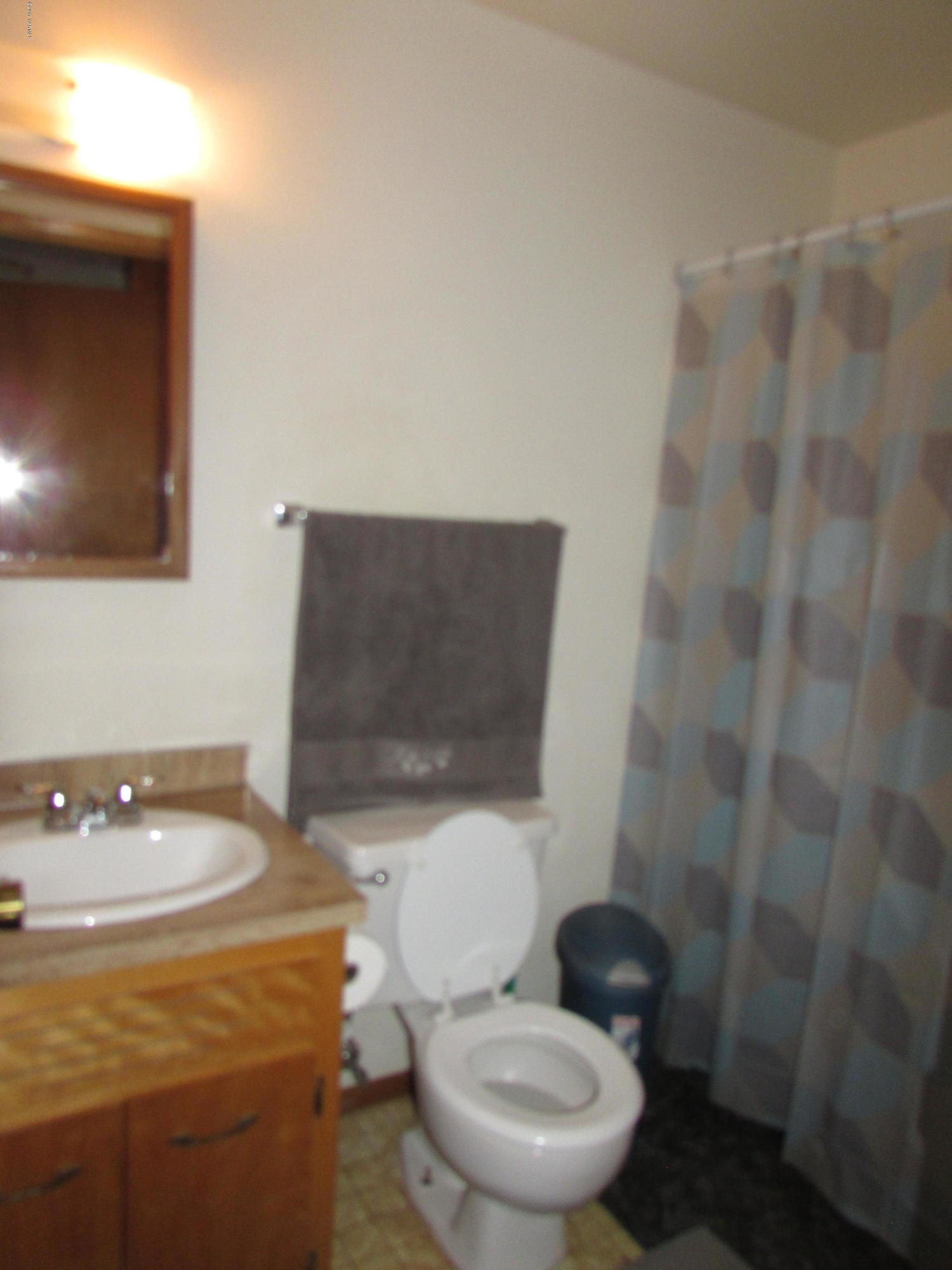 2912 Beaudry Road Moxee, WA 98936 - Photo 16 of 20 a white toilet sitting next to a bathroom sink