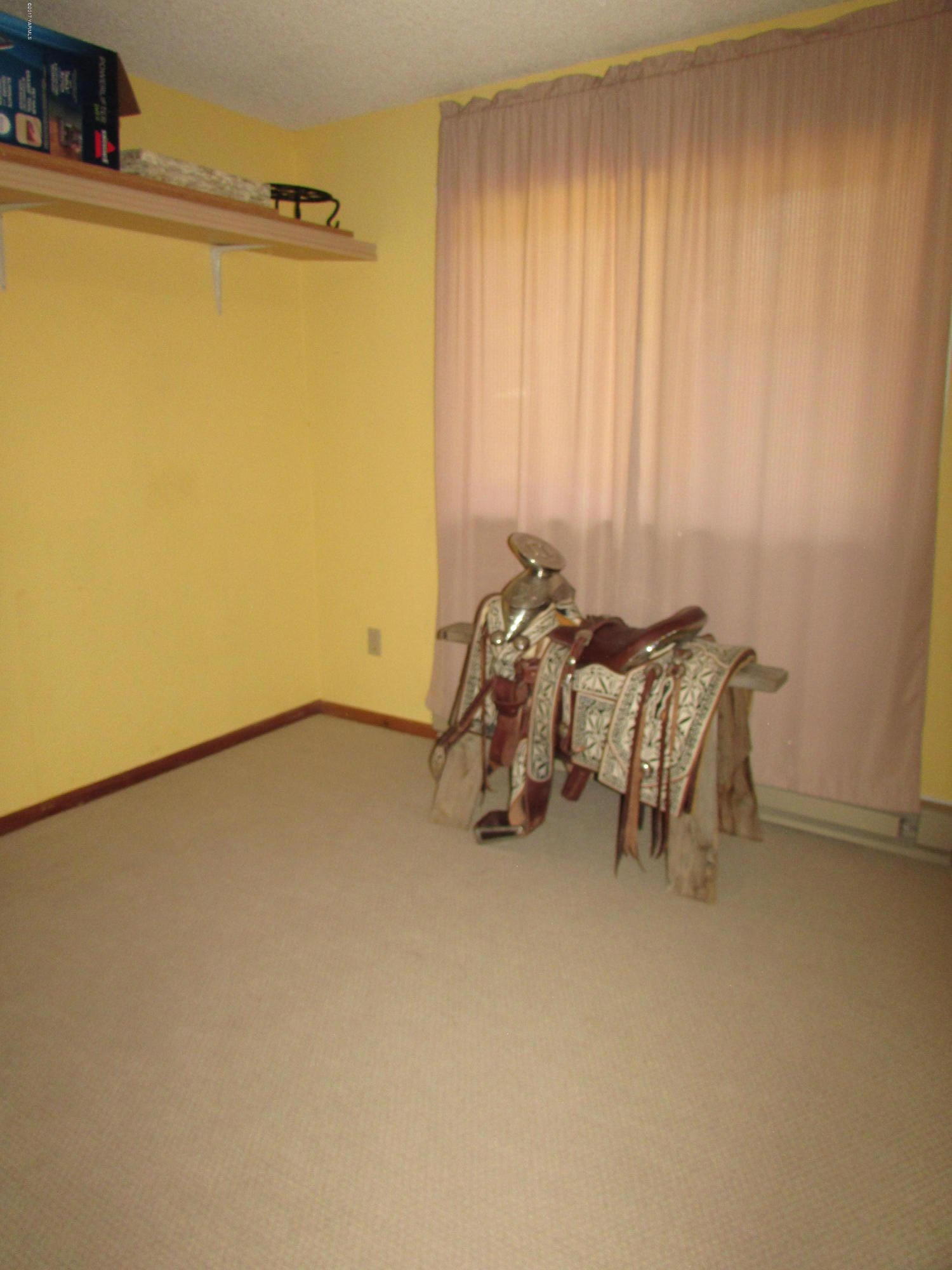 2912 Beaudry Road Moxee, WA 98936 - Photo 19 of 20 a view of a room with furniture and a gate