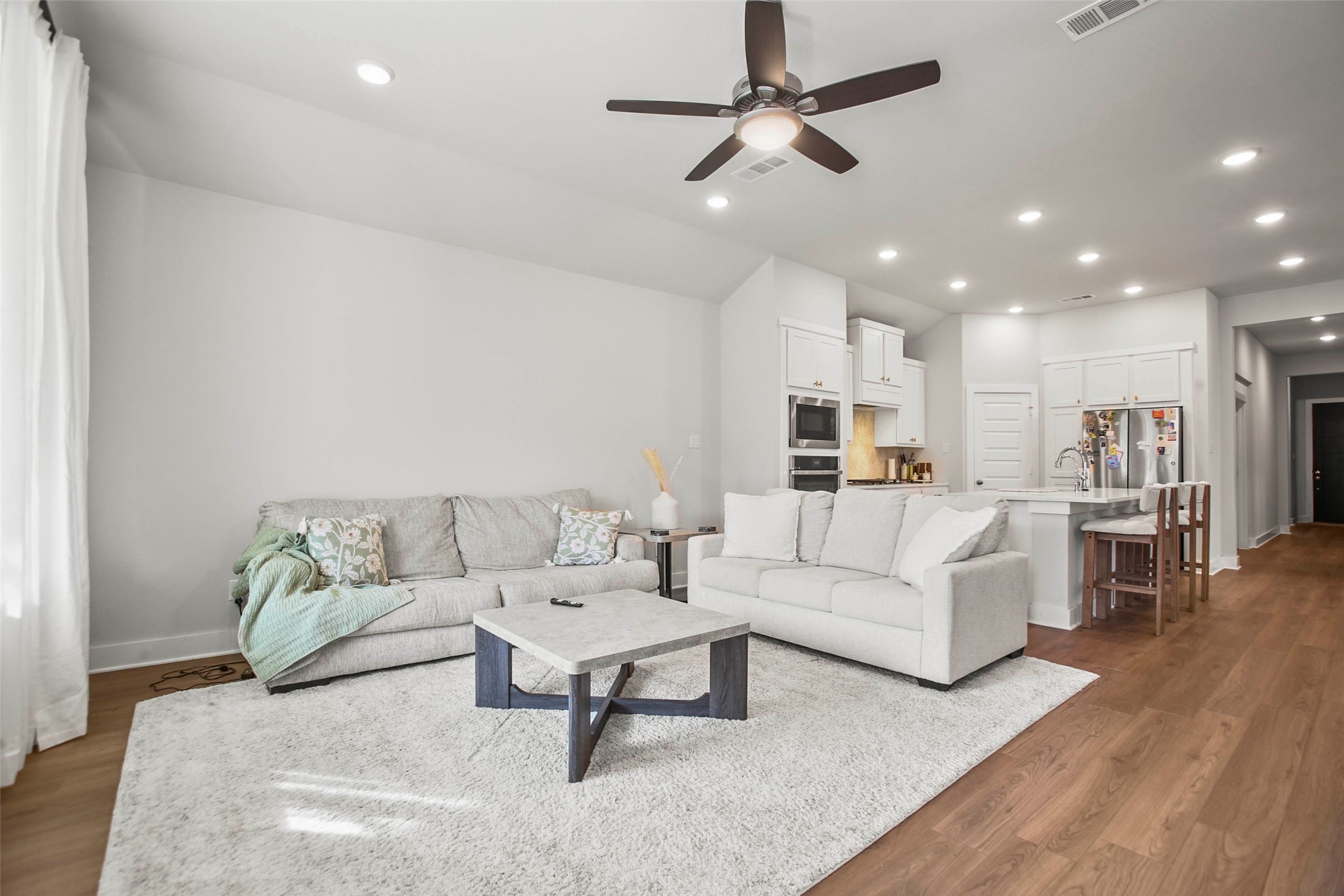 5010 Vly Wind Court Spring, TX 77386 - Photo 12 of 34 a living room with furniture and a view of kitchen