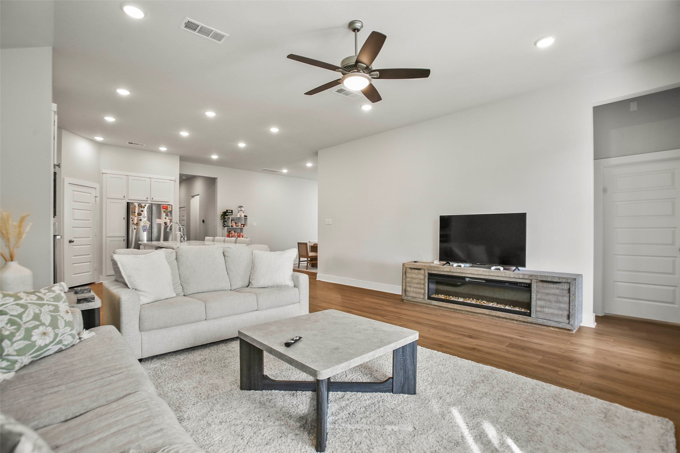 5010 Vly Wind Court Spring, TX 77386 - Photo 13 of 34 a living room with furniture and a flat screen tv