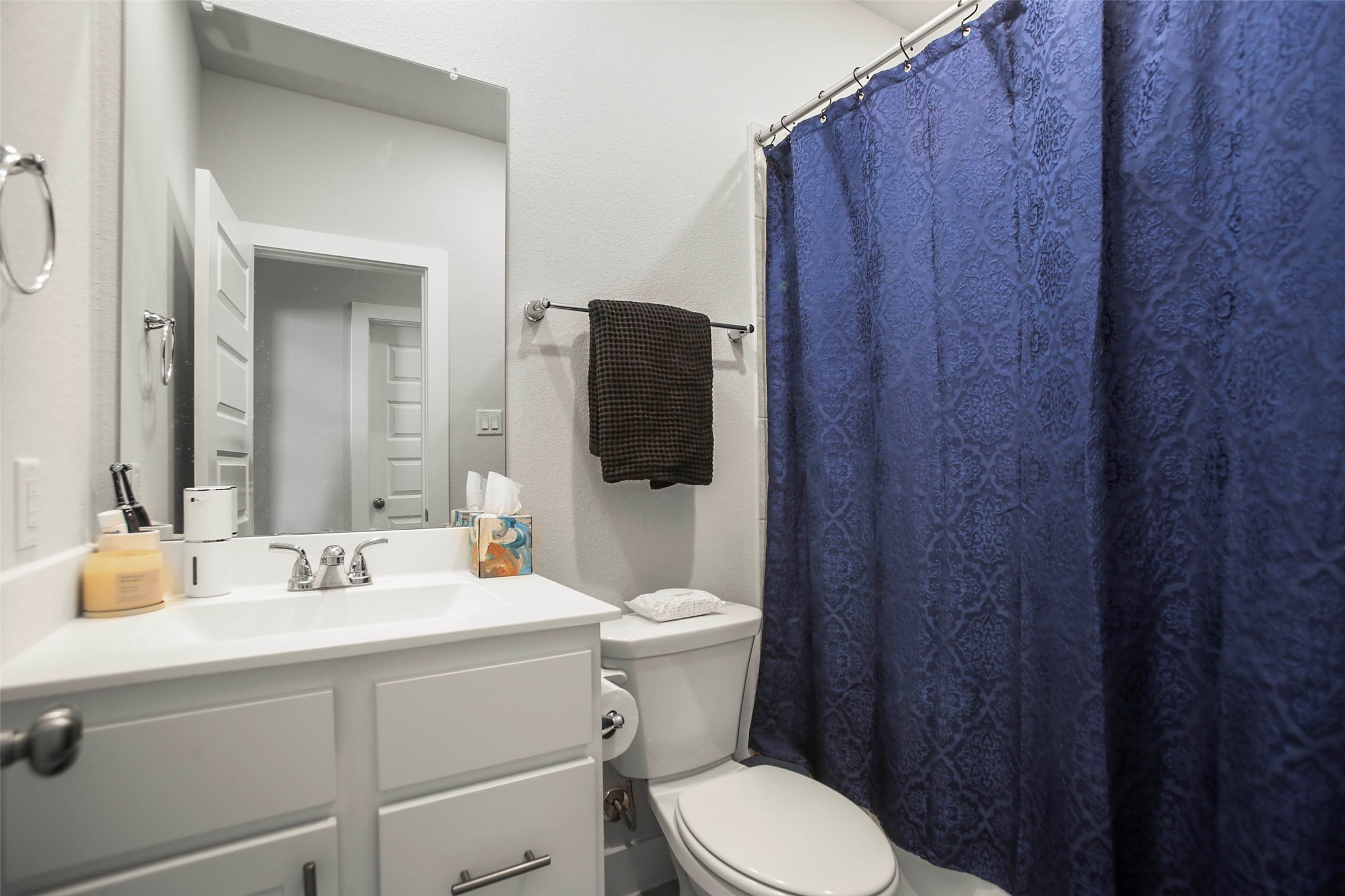 5010 Vly Wind Court Spring, TX 77386 - Photo 16 of 34 a bathroom with a toilet sink and mirror