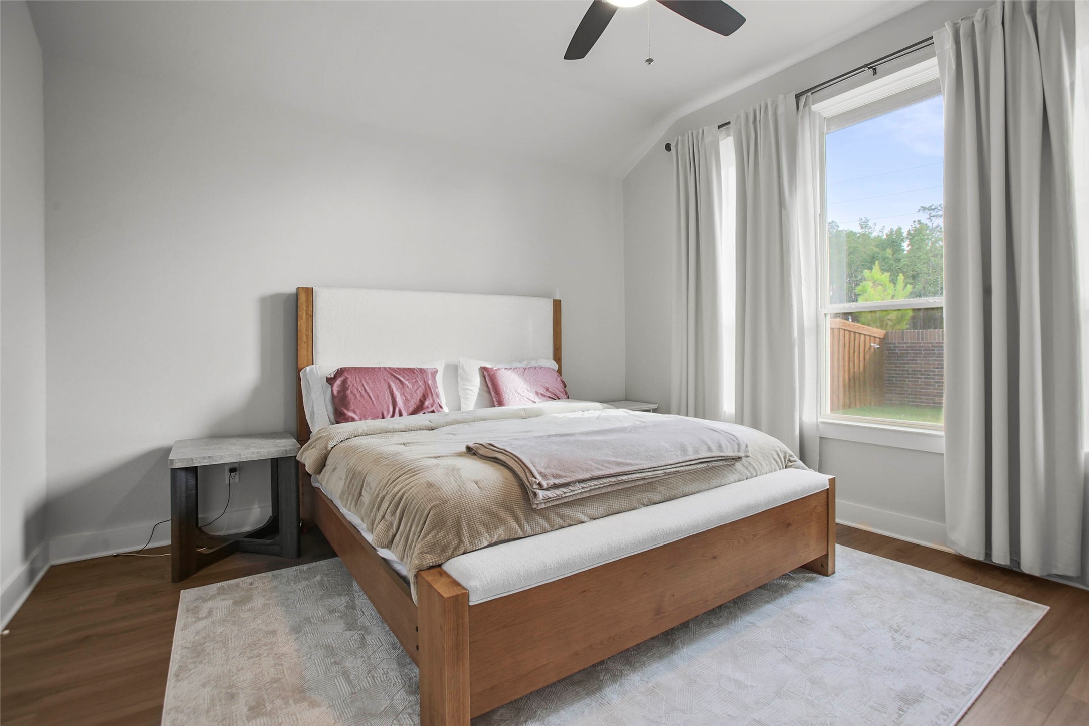 5010 Vly Wind Court Spring, TX 77386 - Photo 17 of 34 a bed sitting in a bedroom next to a window