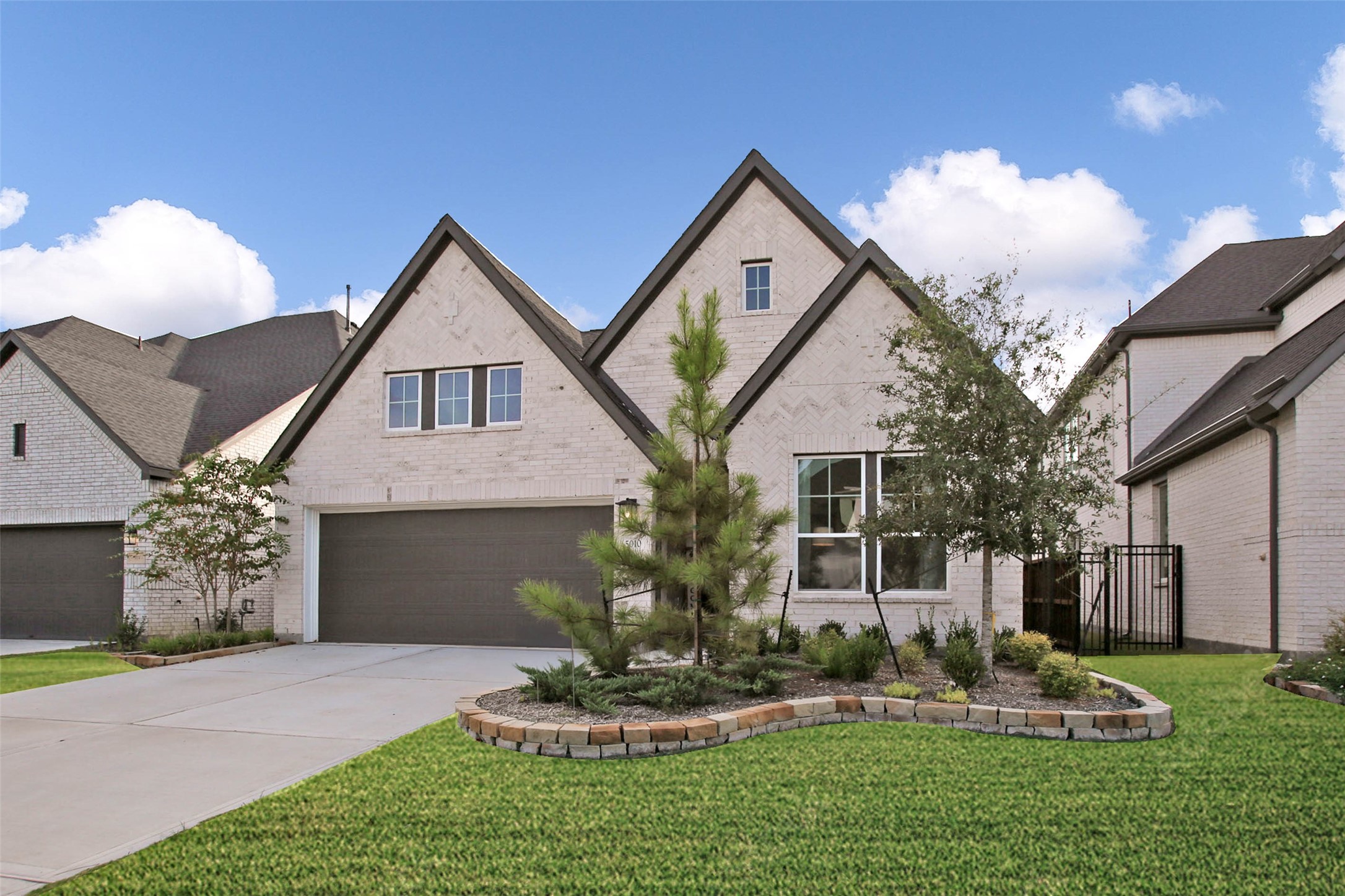 5010 Vly Wind Court Spring, TX 77386 - Photo 2 of 34 a front view of a house with garden