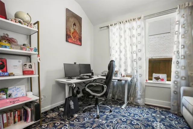 a workspace with furniture and a window