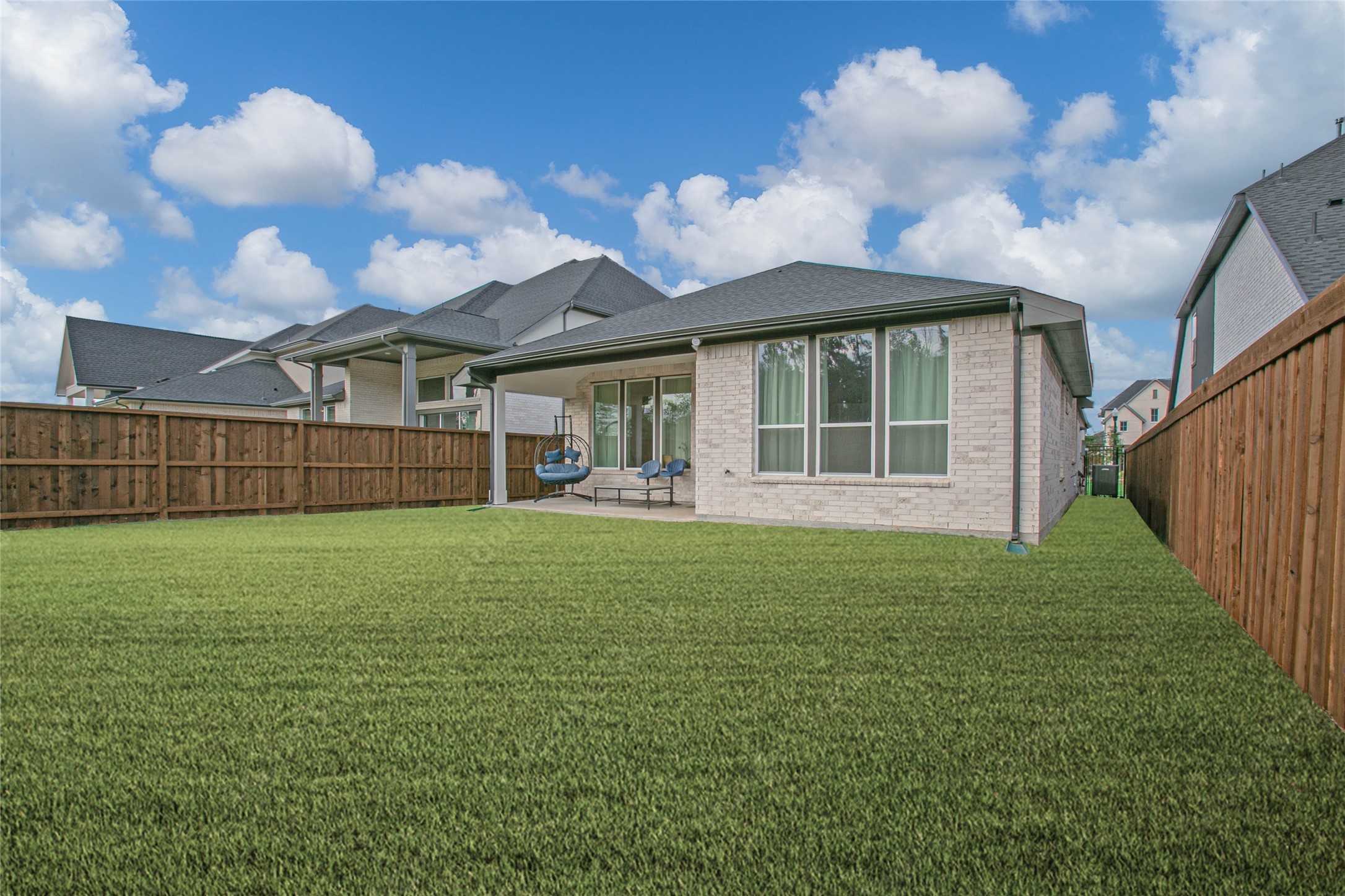 5010 Vly Wind Court Spring, TX 77386 - Photo 29 of 34 a view of a house with a backyard and porch