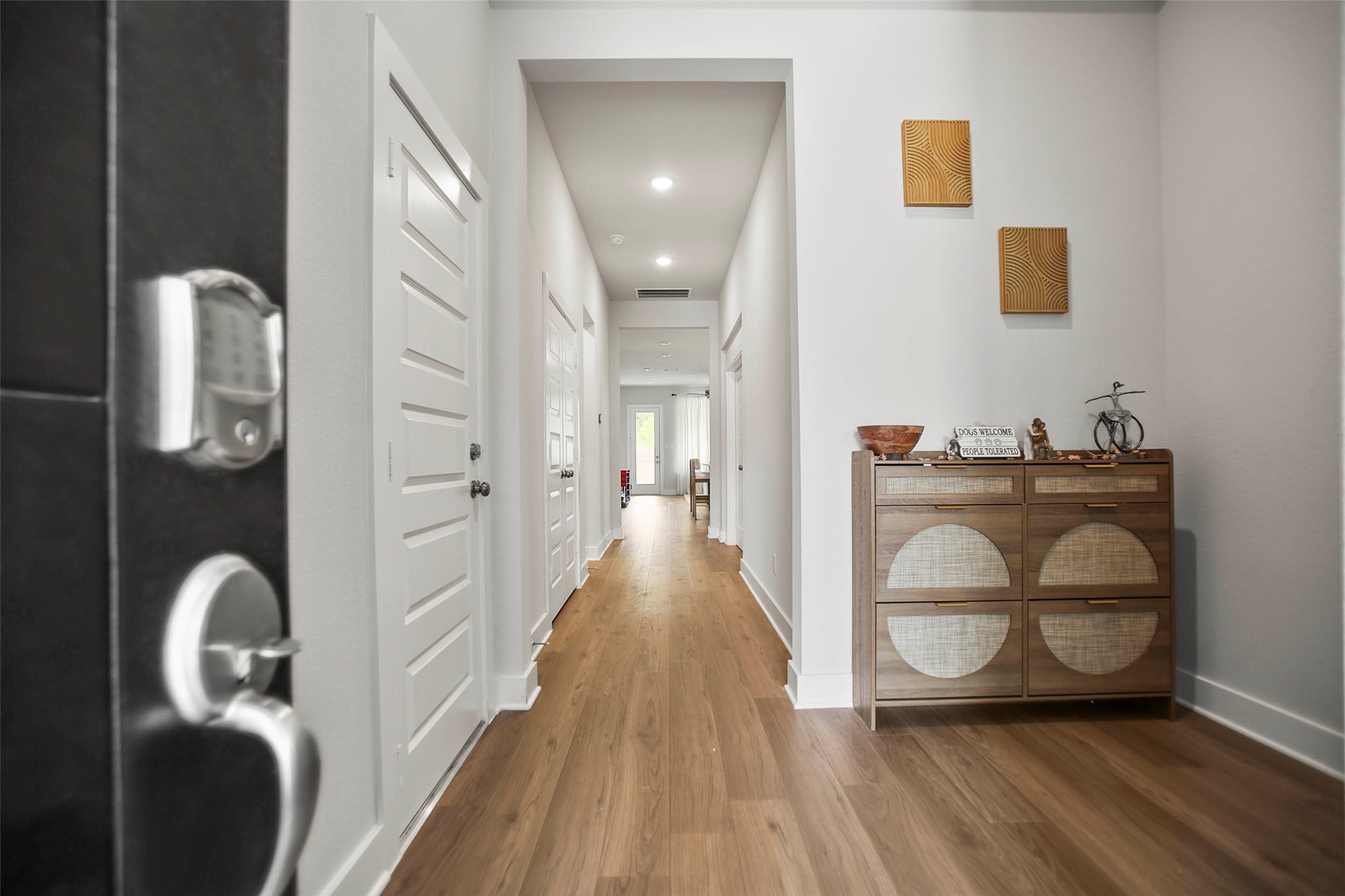 5010 Vly Wind Court Spring, TX 77386 - Photo 4 of 34 a view of a hallway with wooden floor and furniture